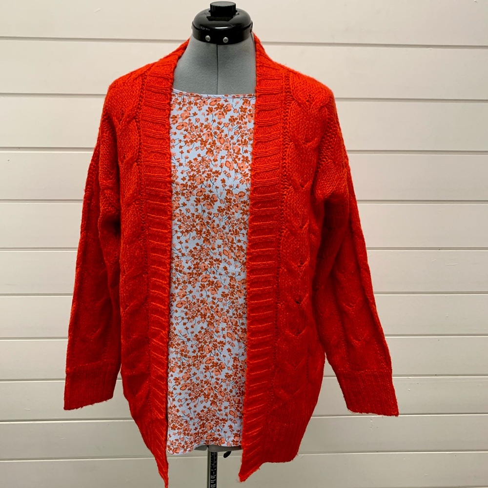 Bold cable knit cardigan in fire engine red.